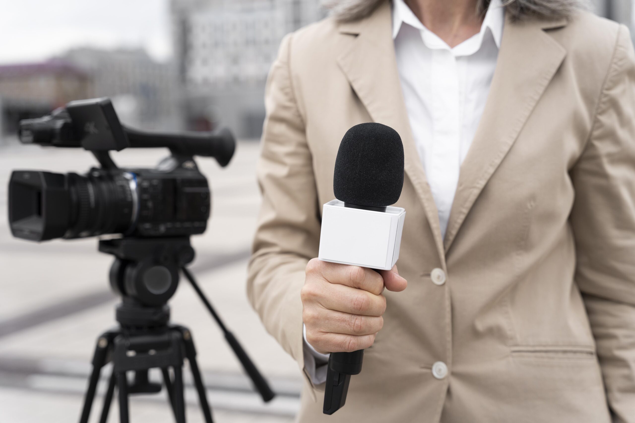 front-view-journalist-holding-microphone